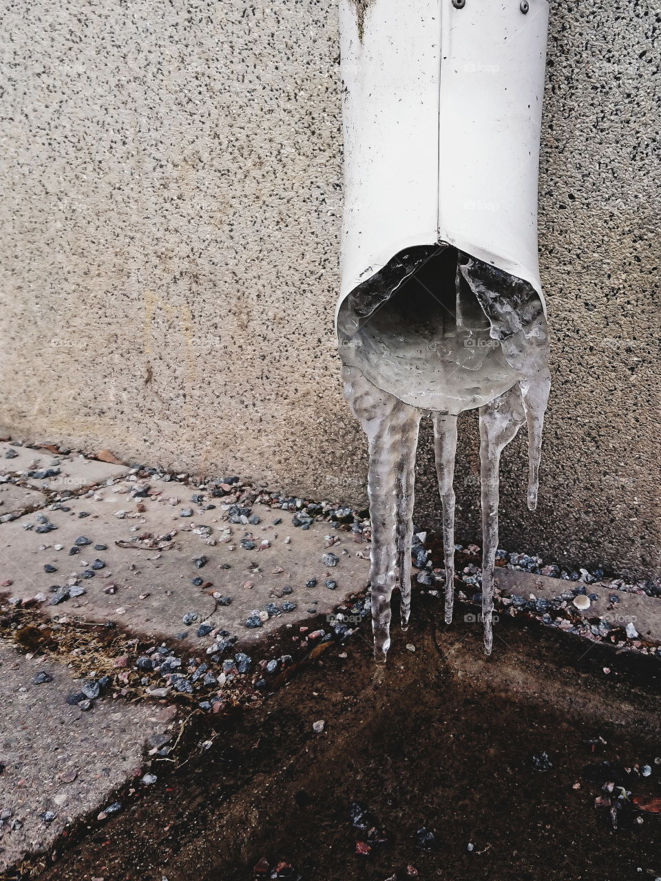 Drainpipe with icicles (close-up)