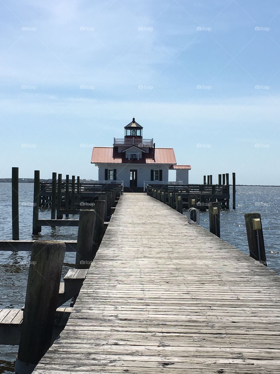 Roanoke Marshes Lighthouse on a beautiful day on the waterfront in Manteo, NC