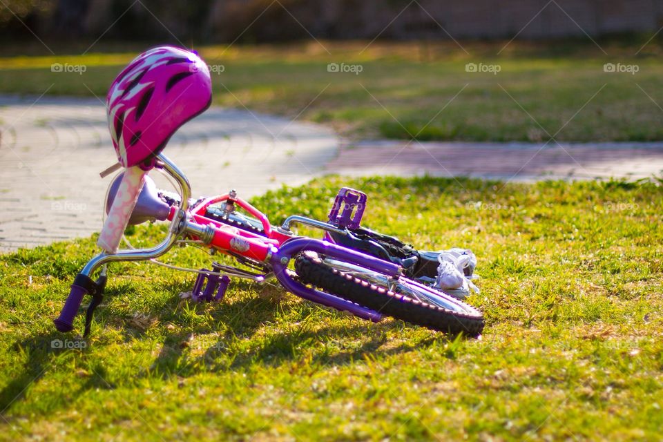 child's bike with helmet