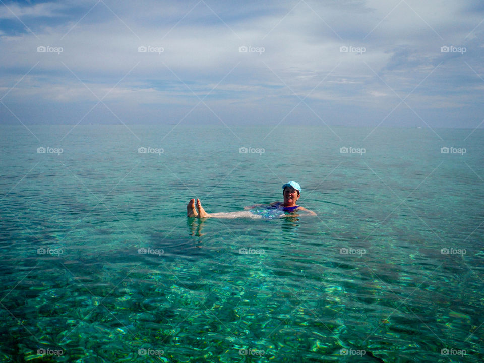 Woman is swimming in ocean