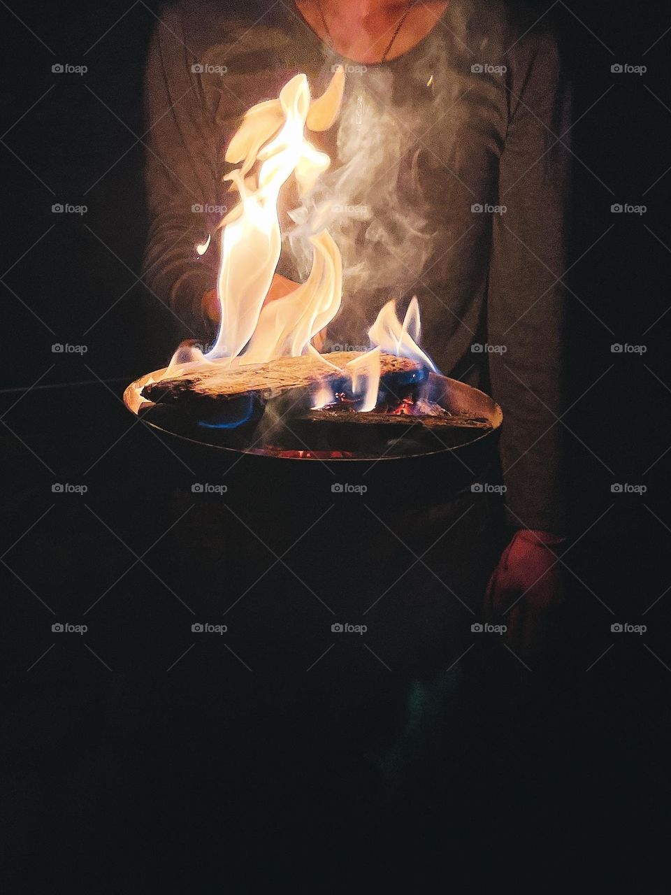 Outdoors camping with warm fire in the night