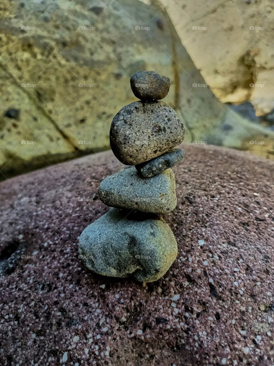 Stack of stones balancing on the river