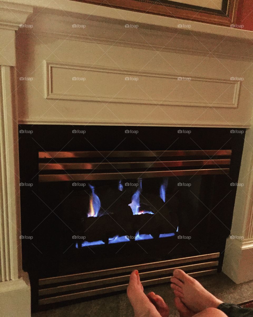 Cozy by the fire in a quaint inn on the lake. 