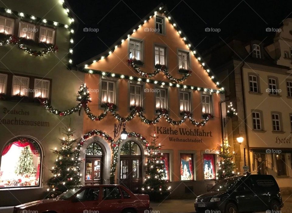 The scene is cozy and enchanting, capturing the essence of traditional European Christmas decorations.