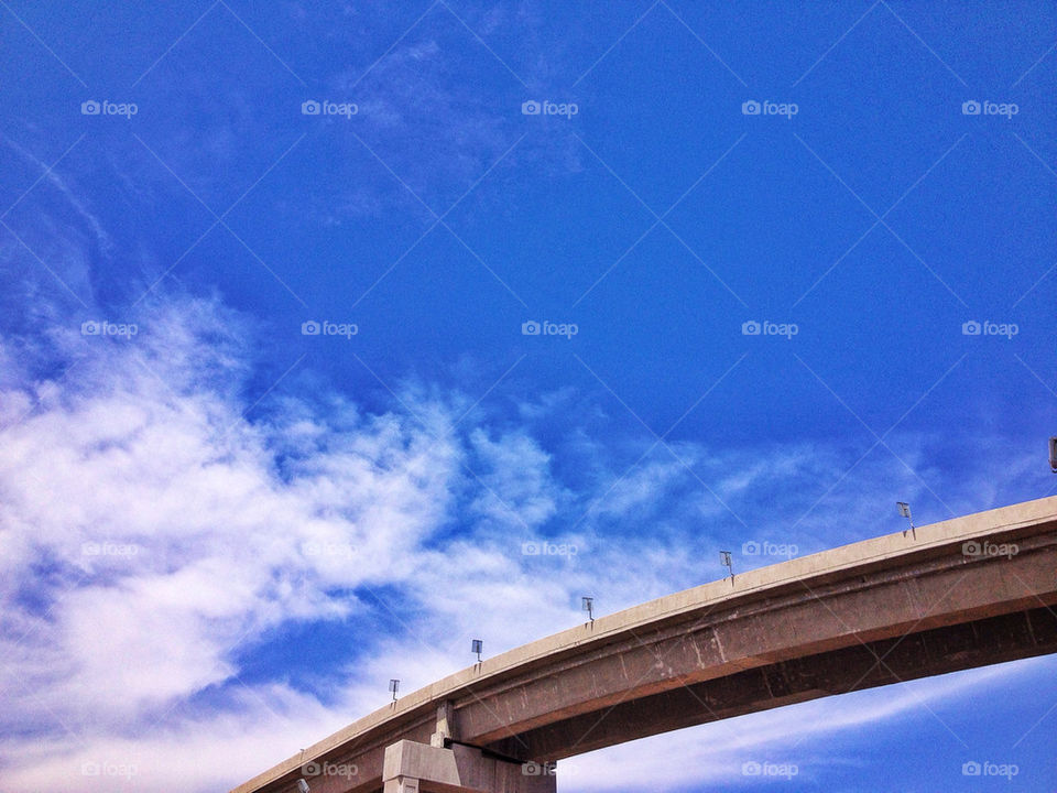 Elevated highway road against a blue sky