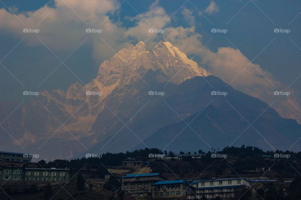 A peak above Namche Bazaar lights up at sunset. Photo taken on the Dhaulagiri Circuit Trek in Nepal.