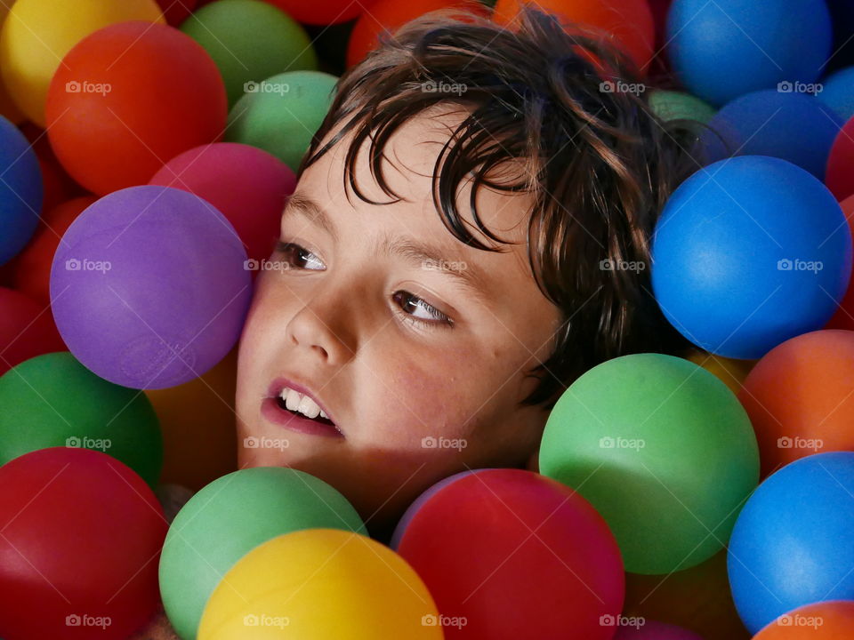 Boy's head in colorful ball