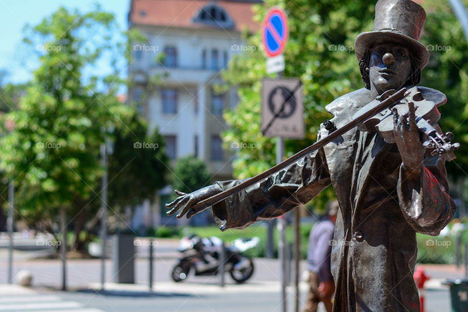 Bronze violinist sculpture. Photo was taken in Szeged Hungary, city center