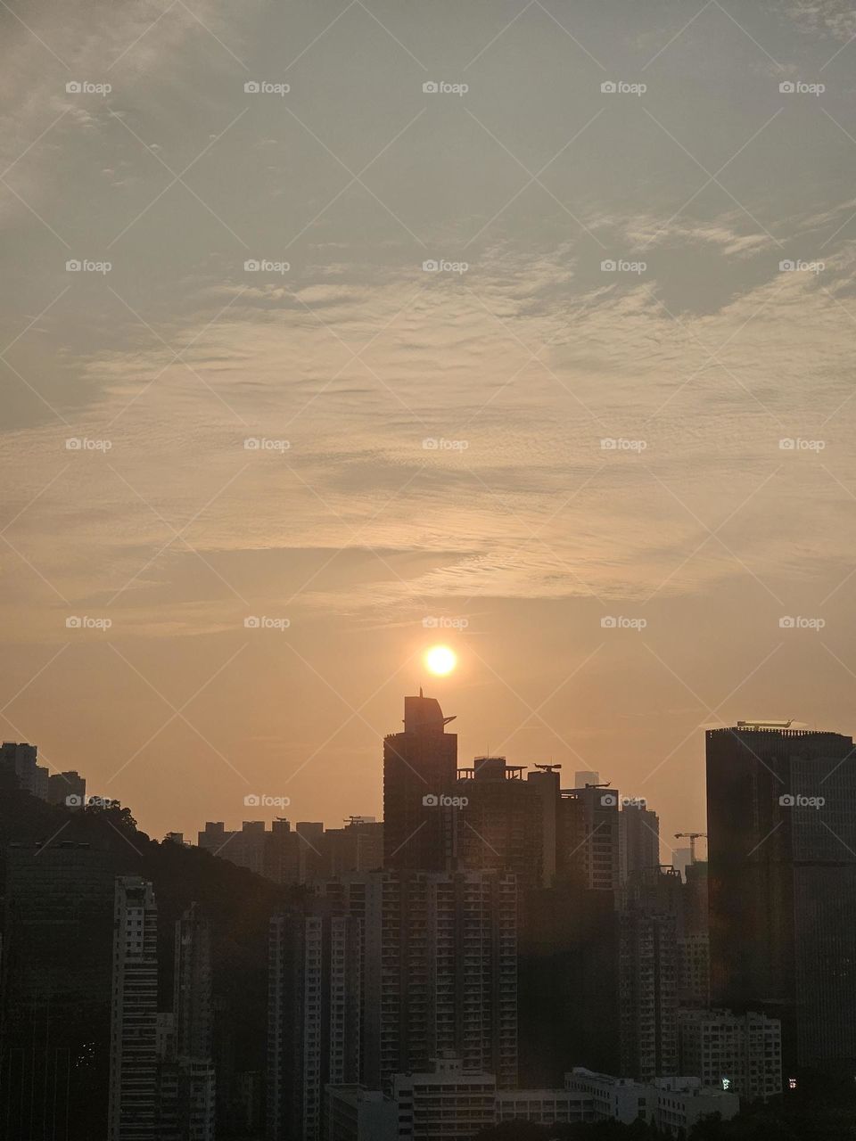 Sunset with buildings silhouette