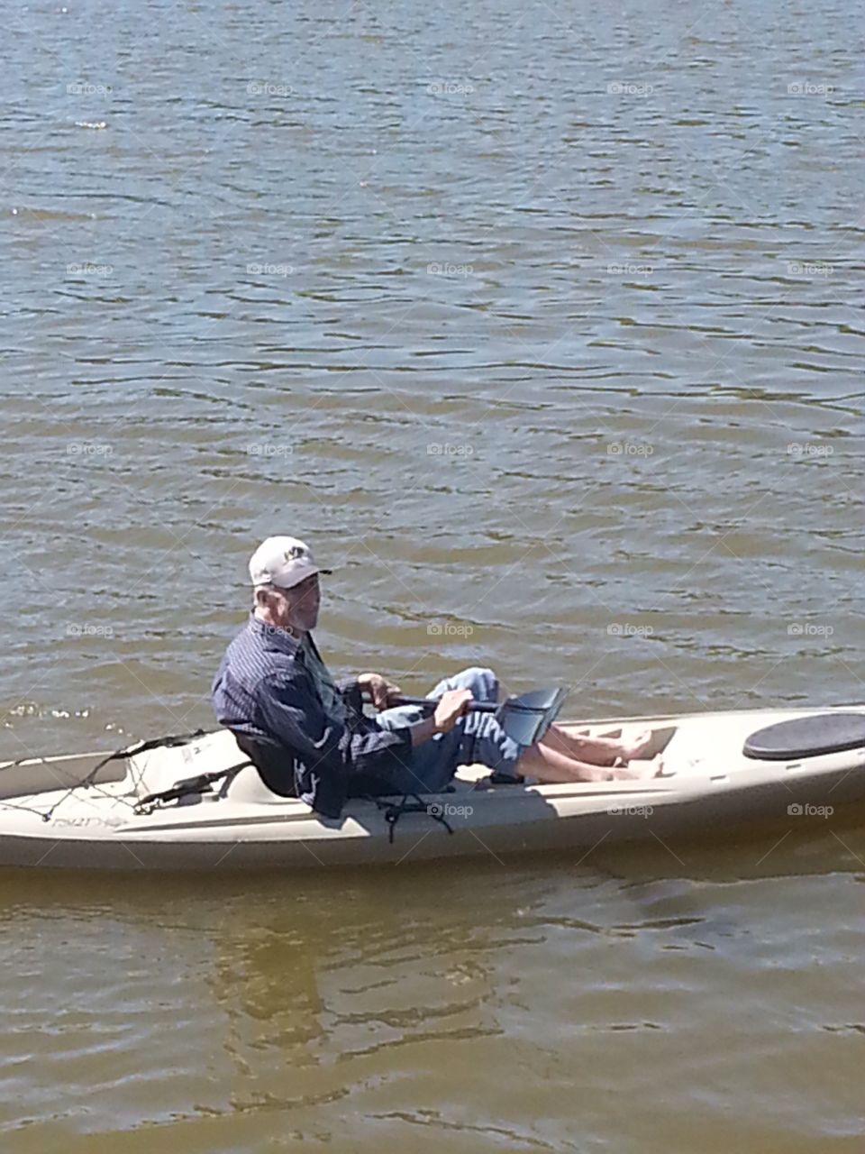 Man in a kayak on the water. 
