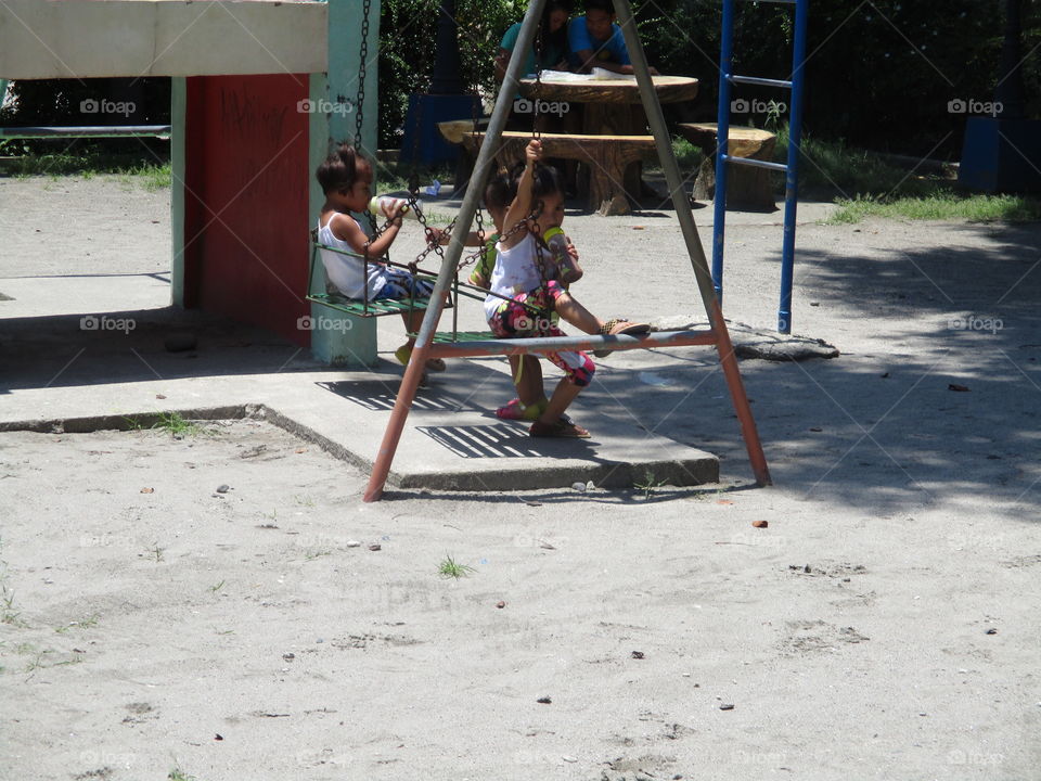 kids play swing moment