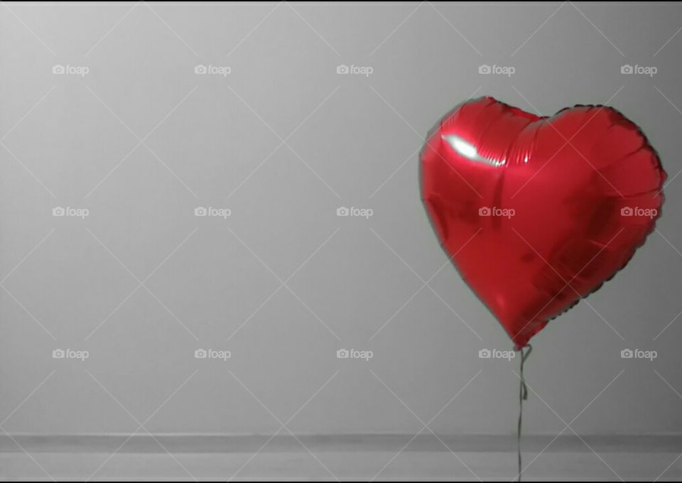 Lovely. A heart-shaped balloon in a empty room