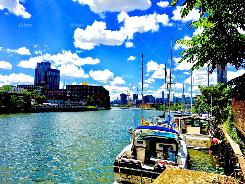 The East River with boats by Newtown Creek near the Pulaski Bridge. The photo was taken in 2020. Hypnotic Productions