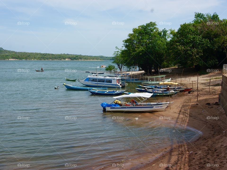 Boats docked 
on a river in Santarem , Brazil