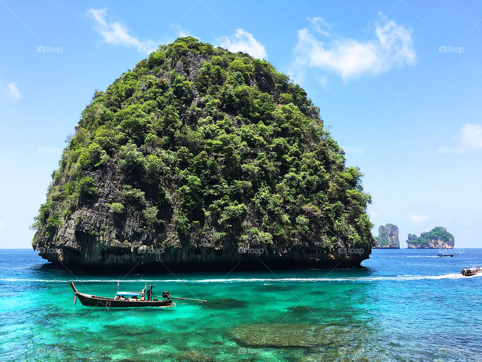 Beautiful tropical island in turquoise sea water in Thailand 