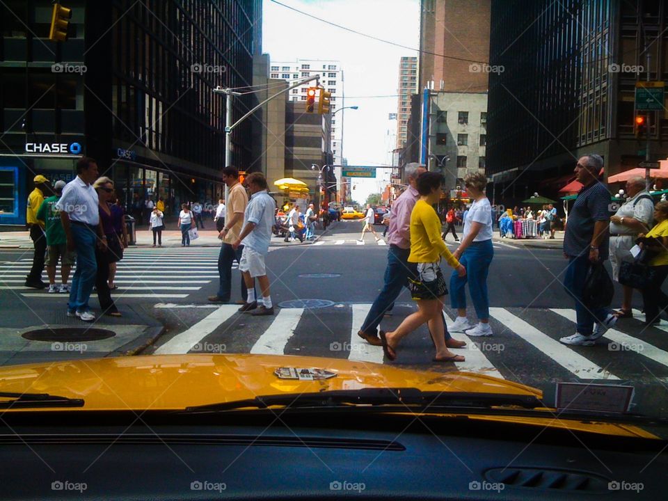 Yellow taxi at crossing