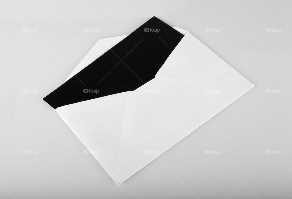 Black invitation card mockup with white envelope