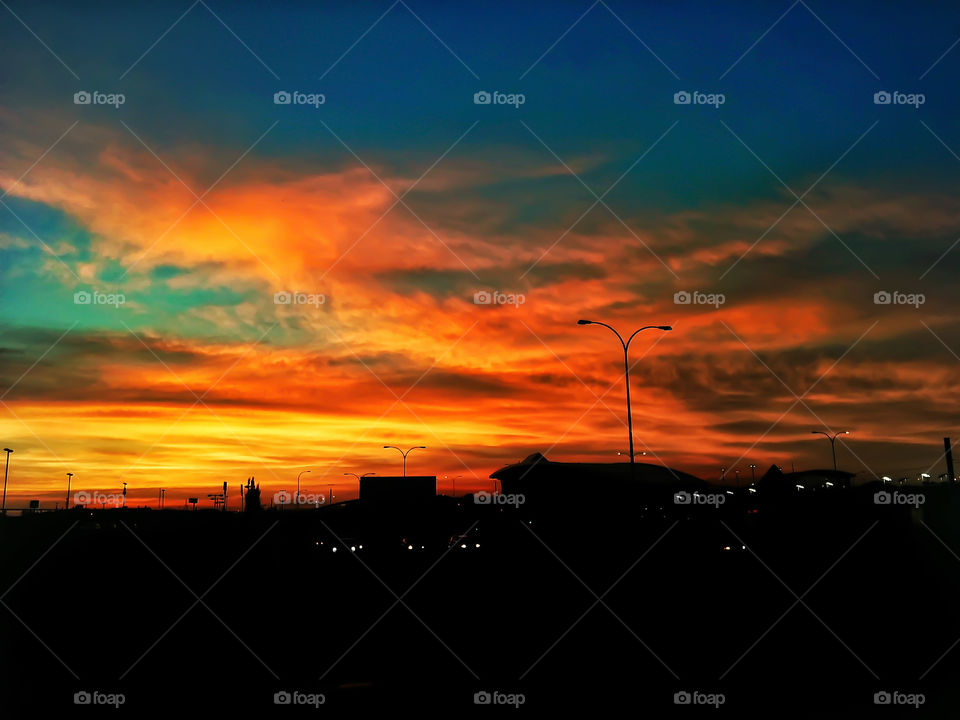 Fiery sunset over Calgary. Those that seek fire find water