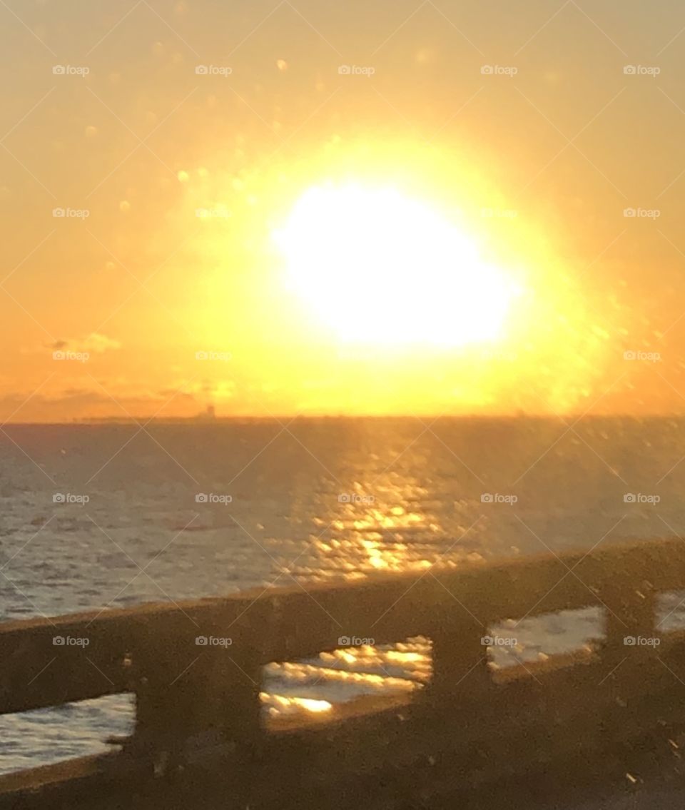 Sun coming up after storm Zeta  on Lake Ponchatrain in New Orleans, Louisiana giving off a glorious glow on the water. 
