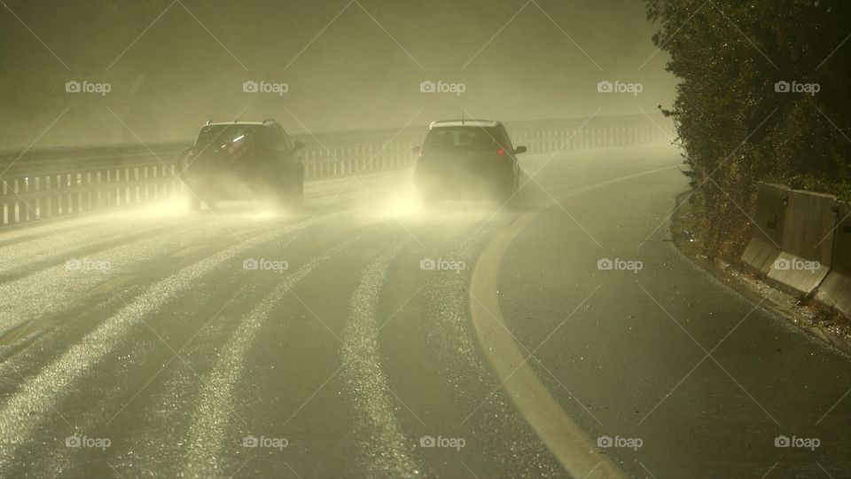 Cars driving on the rain