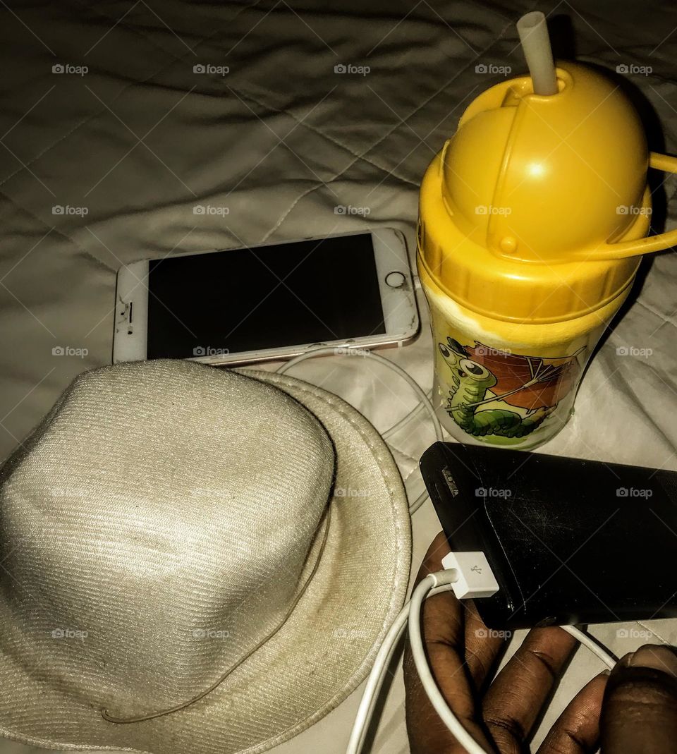 who would want to leave these accessories behind on a vacation. an emergency water container, very handy, jotter and pencil, sunglasses, power bank, and your mobile phone, too good to go.