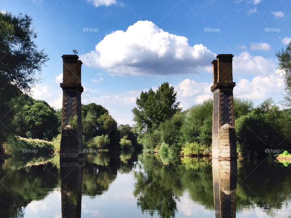 Remains of a bridge in a river 