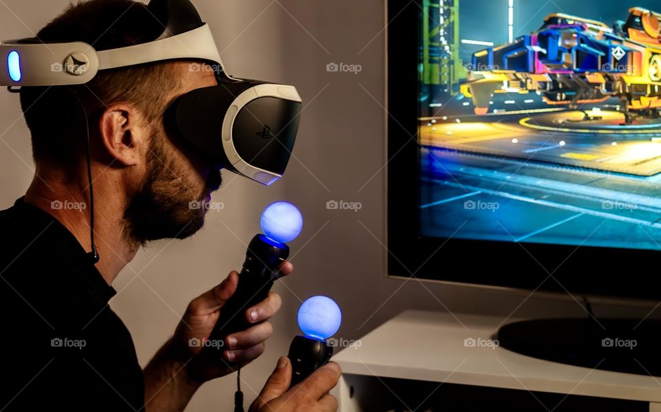 A man playing a game wearing a VR headset