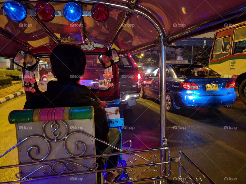 a night ride in a tuk tuk in the streets of bangkom