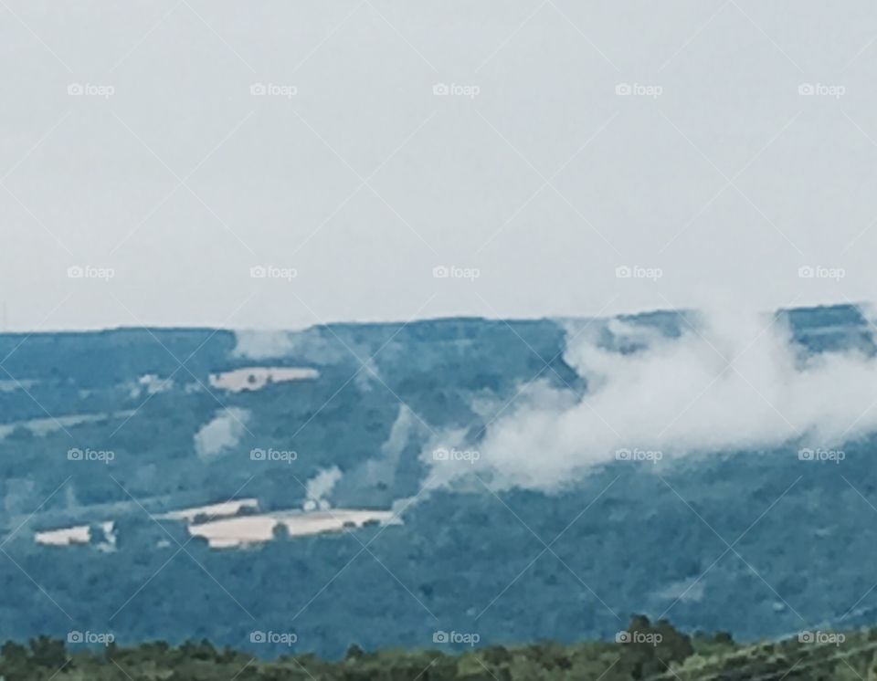 Mountains with low clouds.