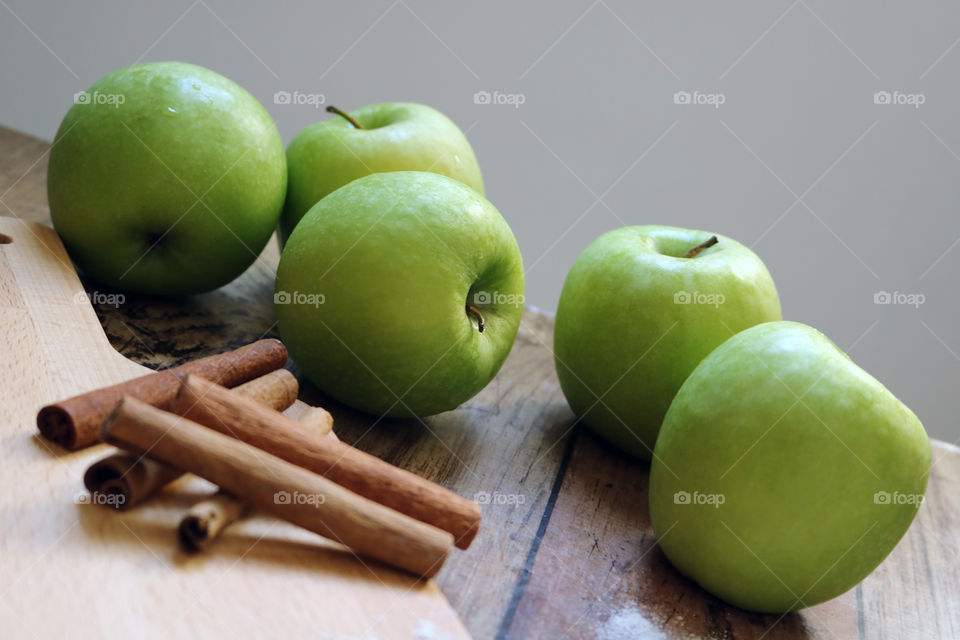 Green apples and Cinnamon sticks