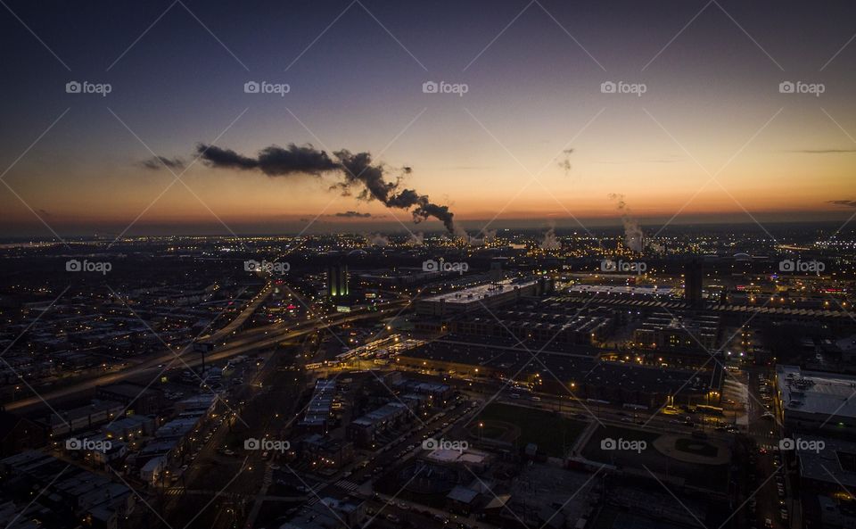 Sunset over South Philadelphia, PA with the gas refinery pumping steam. 