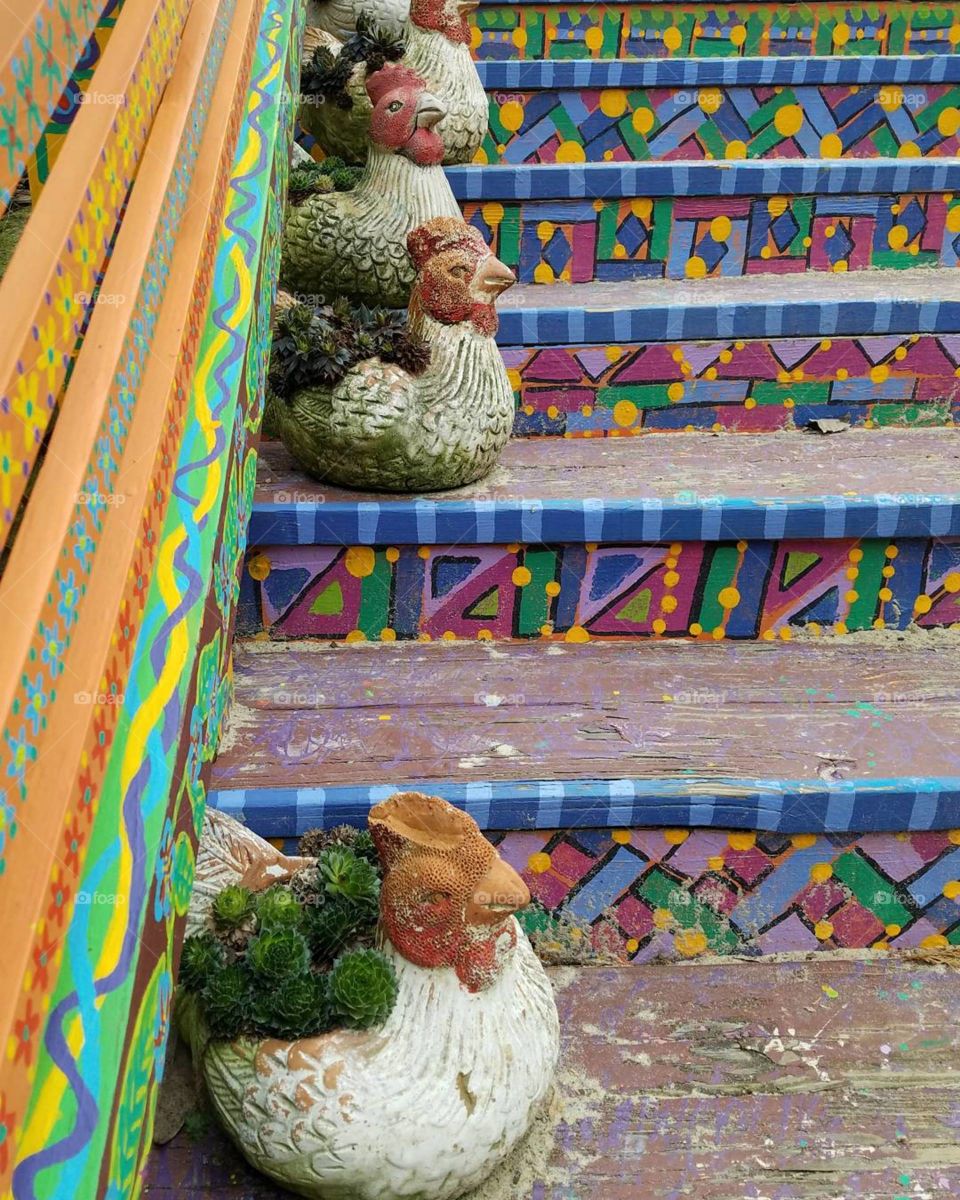 colorful folkart chickens on mosaic steps