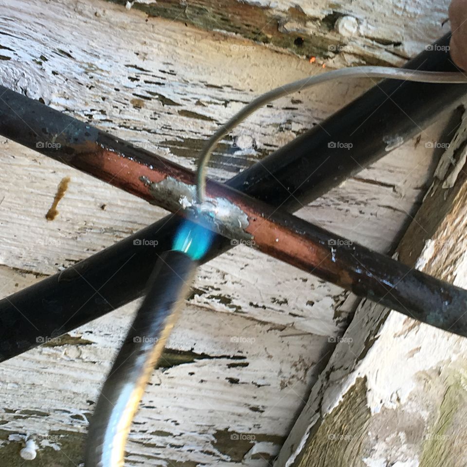 Leaking pipe fixed with flux, solder & flame