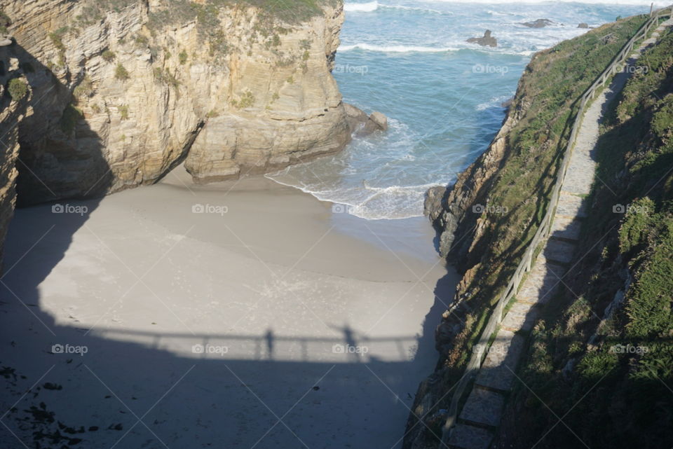 Ocean#rocks#bridge#shadows#humans#nature