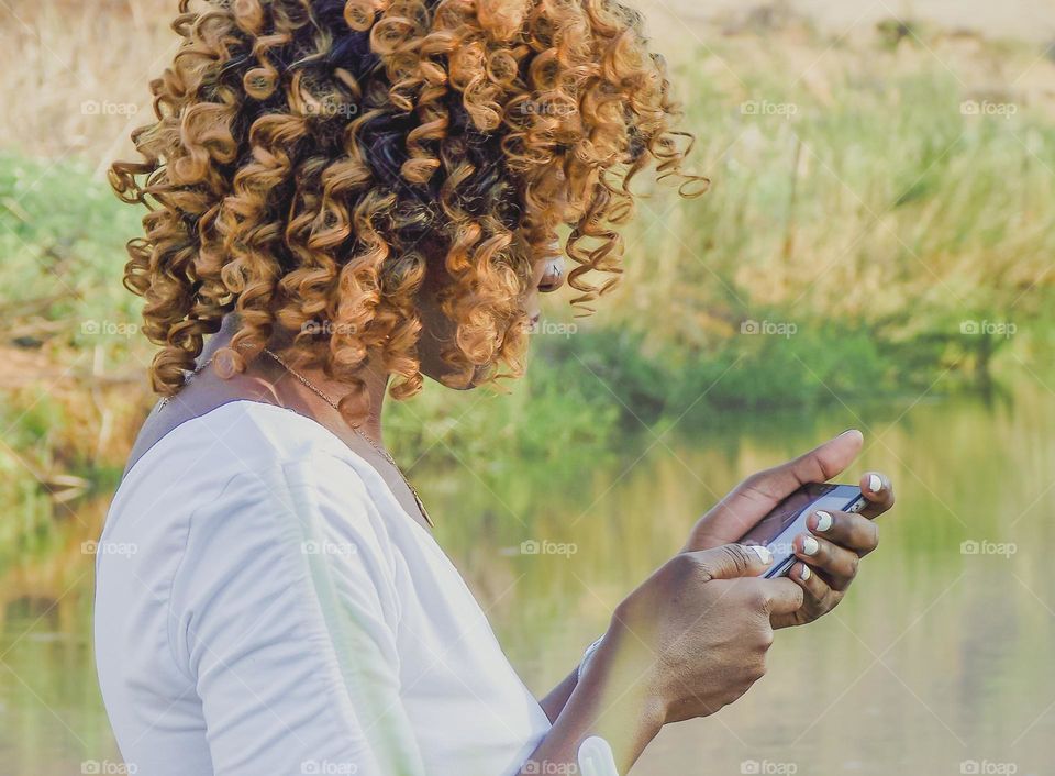 a woman holding a mobile phone