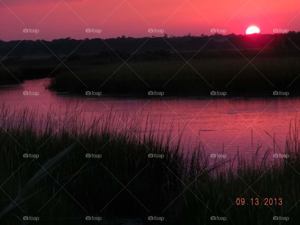 Sunset on the Marsh. 
This beautiful sunset was captured over the intercoastal marsh side in Wrightsville Beach, NC