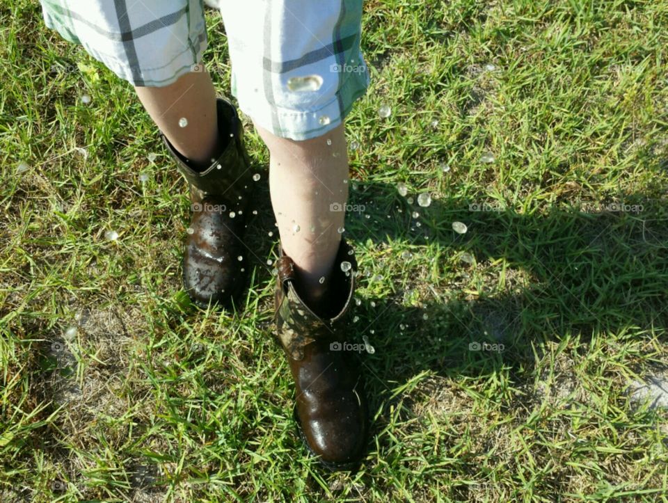 lake life. water droplets splashing out of boots