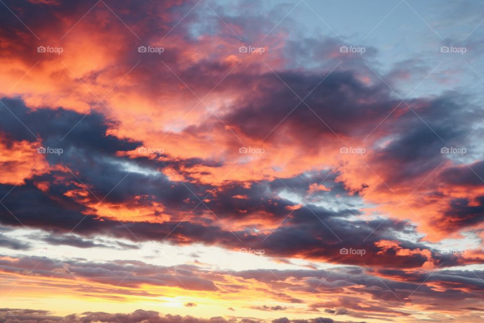 Burning sky after sun setting down the mountain 