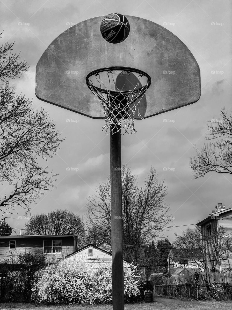 Shooting hoops, basketball about to go in the hoop, shooting a foul shot, jump shot in basketball, basketball and hoop