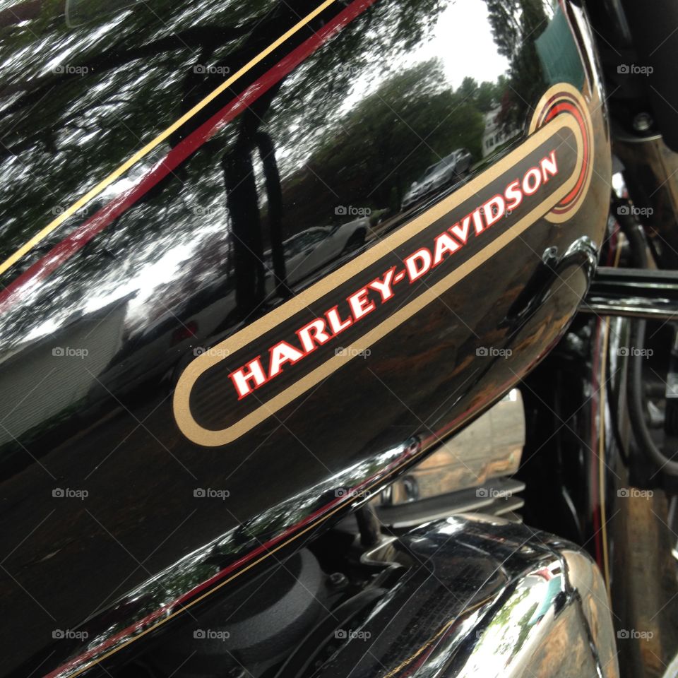 Gas Tank Harley Davidson. Pic of a 1999 Harley Davidson FLHTC gas tank with the Logo from that year. Bike color is black.