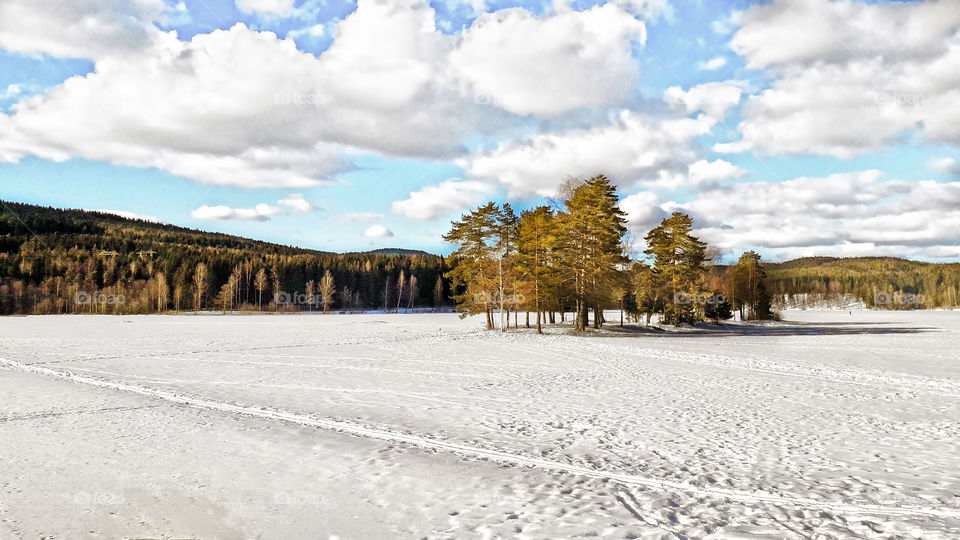 Frozen lake Søgnsvann, with snowy surface, in Oslo, Norway. Breathtaking scenery.