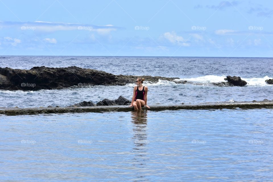 woman in natural pool on la gomera canary island in Spain