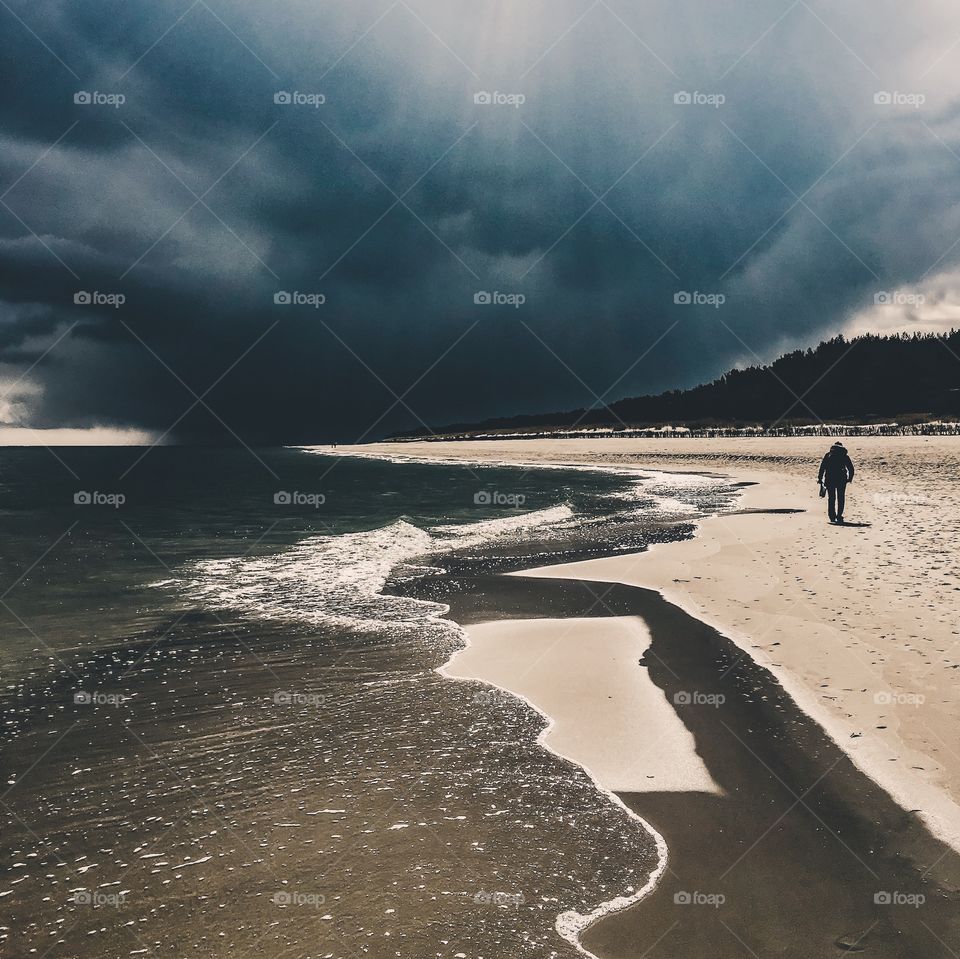 Scenic view of person on beach