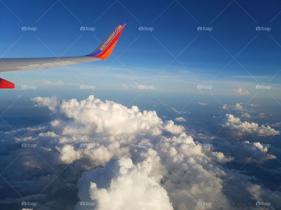southwest wing over clouds