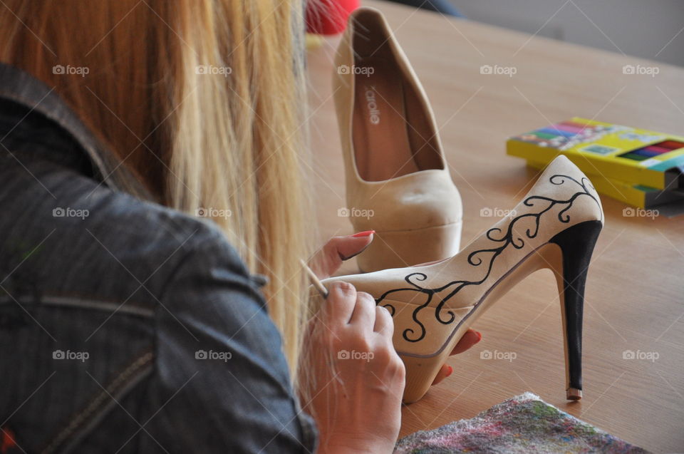 girl painting shoes
