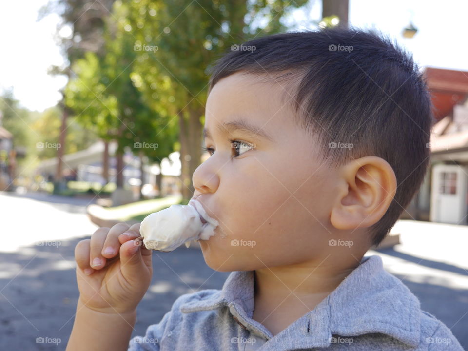 Ice cream. Boy eating ice cream 
