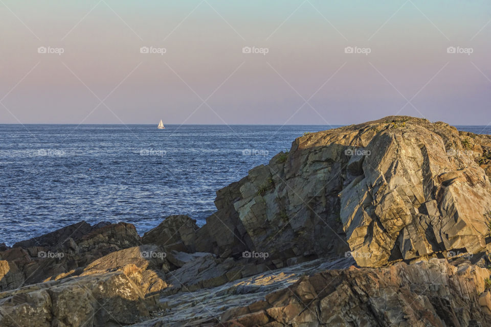 Tiny sailboat off the coast of Maine 