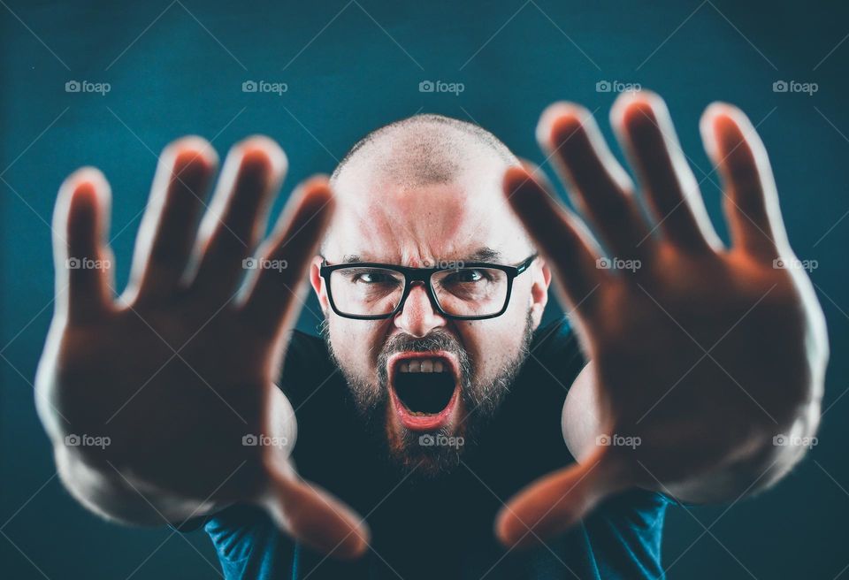 Portrait shot of angry bearded man