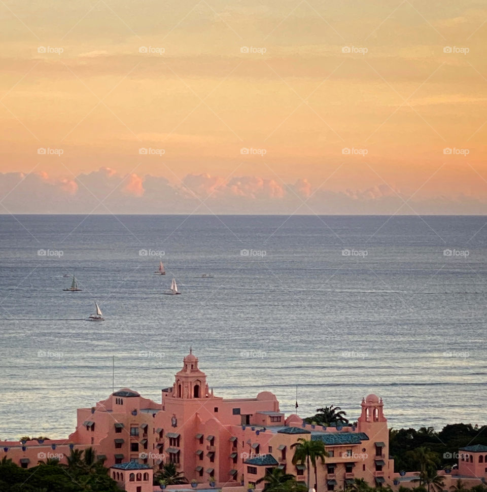 View of the Royal Hawaiian hotel in Waikiki, Hawaii at sunset 