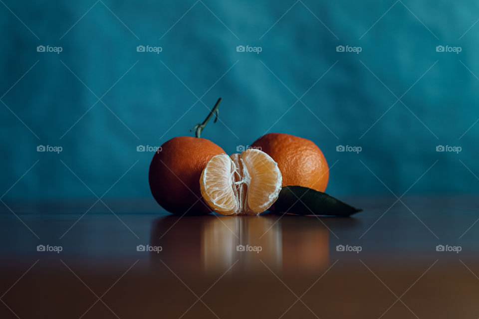 Close-up of tangerine fruits on table